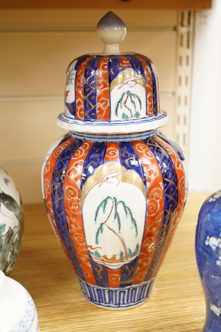 An Imari vase and cover-28cm high, a Chinese jar and prunus vase and a small blue and white jar.